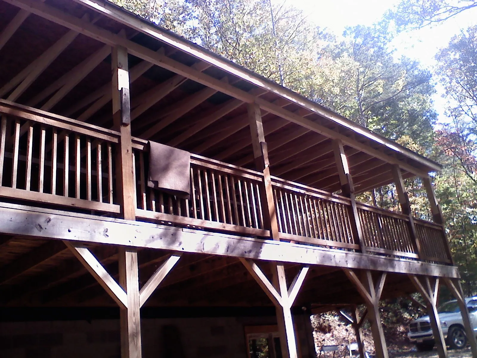Timber framing under a new elevated porch and deck — Roof Leak Repair in Hague by Roofing Brothers